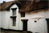 Ancient cob building in Devon, England. The date plate reads 1539.