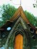 Close-up view of sculptural use of cob on entrance.